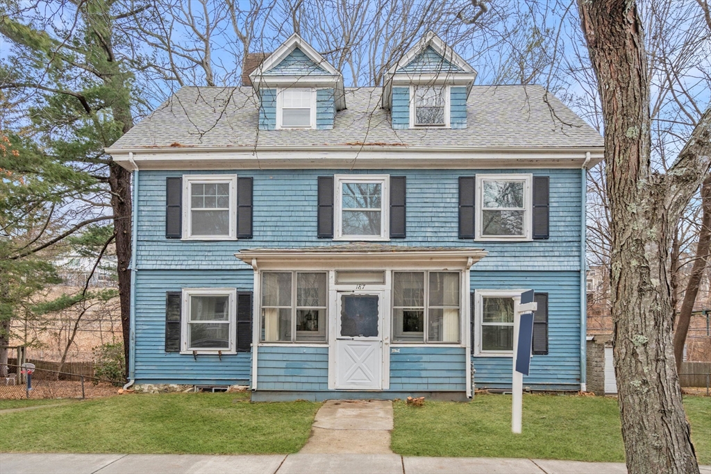 187 Clark Road Brookline, MA 02445 - Photo 1 of 40 a front view of a house with a yard