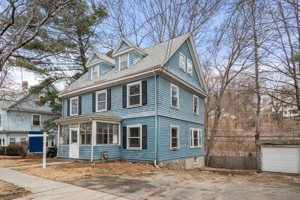187 Clark Road Brookline, MA 02445 - Photo 14 of 40 a front view of a house with a yard