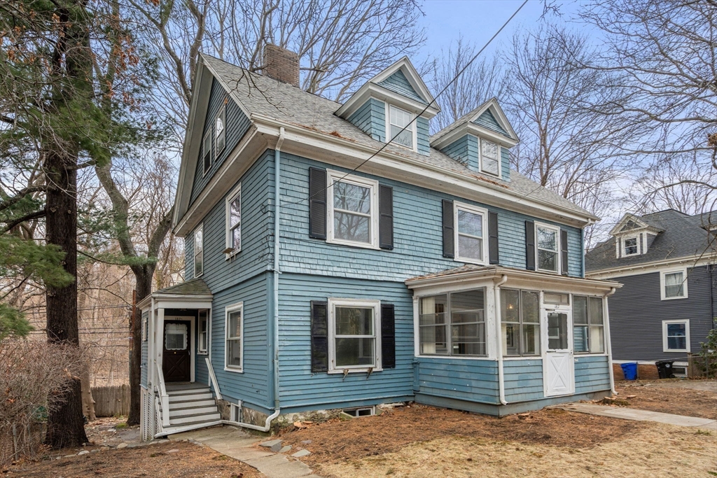 187 Clark Road Brookline, MA 02445 - Photo 16 of 40 a front view of a house with a yard