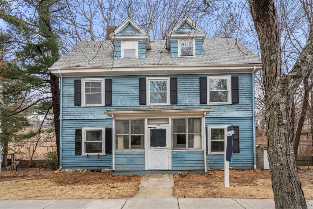 187 Clark Road Brookline, MA 02445 - Photo 18 of 40 a front view of a house with a yard