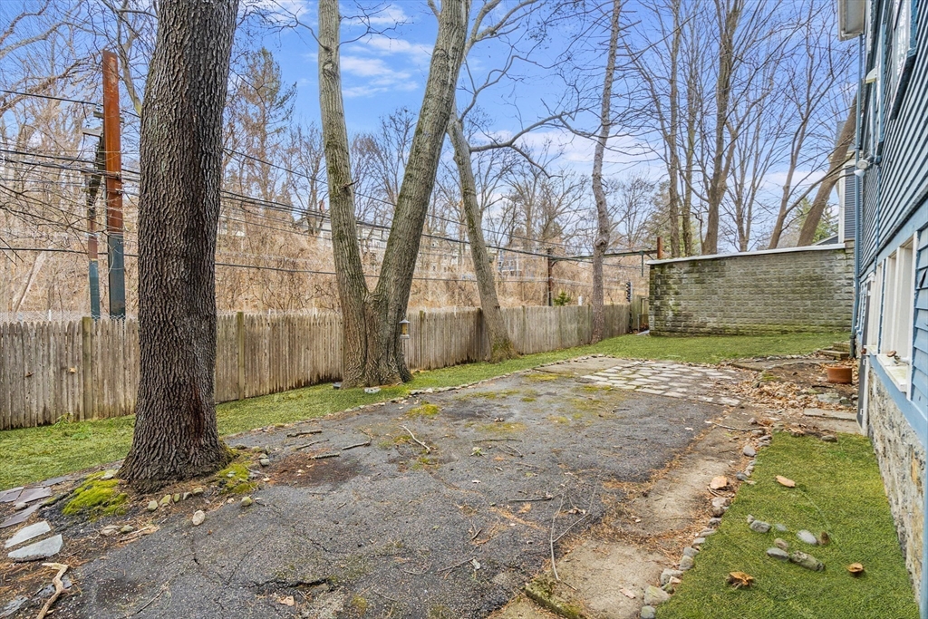 187 Clark Road Brookline, MA 02445 - Photo 22 of 40 a backyard of a house with lots of green space