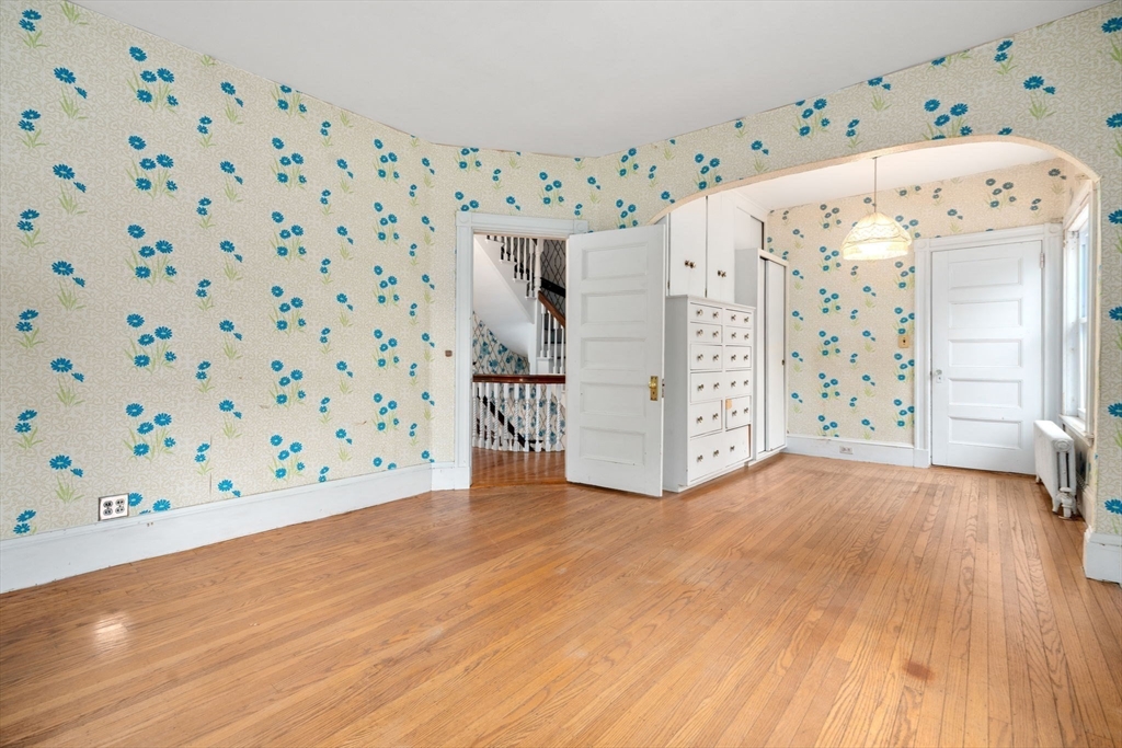 187 Clark Road Brookline, MA 02445 - Photo 23 of 40 a view of livingroom with furniture and wooden floor