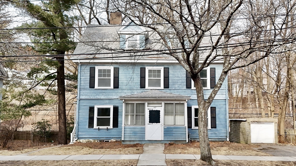 187 Clark Road Brookline, MA 02445 - Photo 25 of 40 a front view of a house with a tree