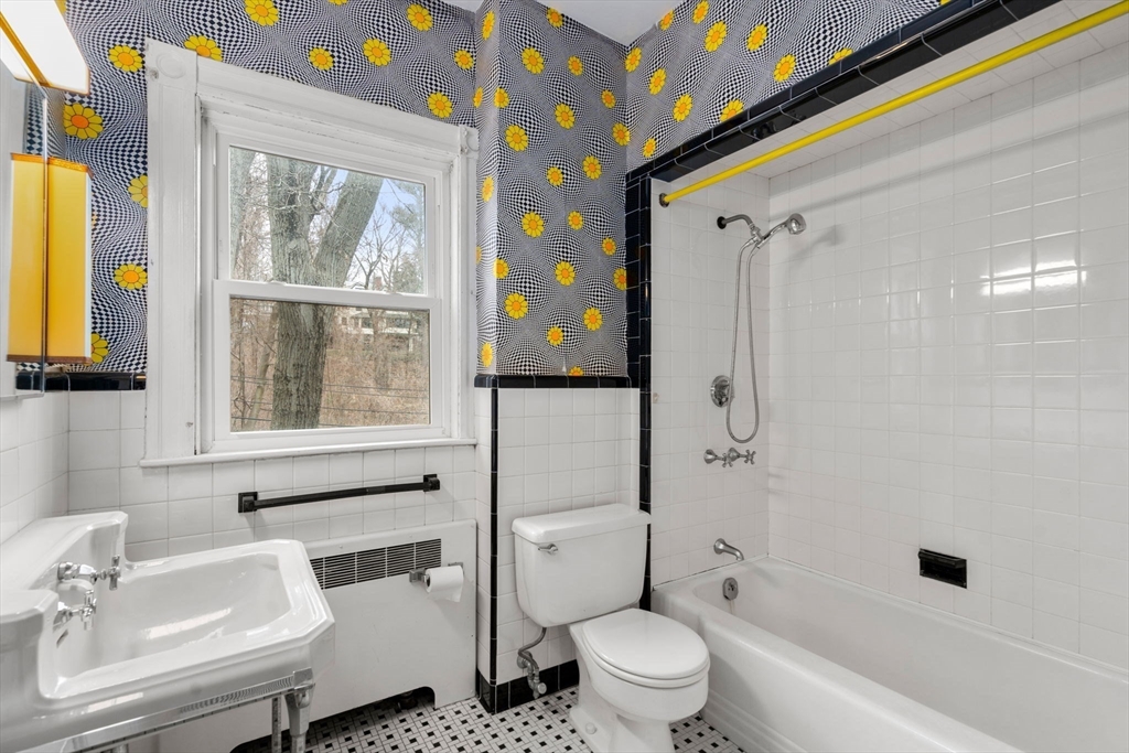187 Clark Road Brookline, MA 02445 - Photo 35 of 40 a bathroom with a sink toilet and shower