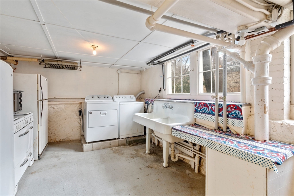 187 Clark Road Brookline, MA 02445 - Photo 36 of 40 a storage room with washer and dryer