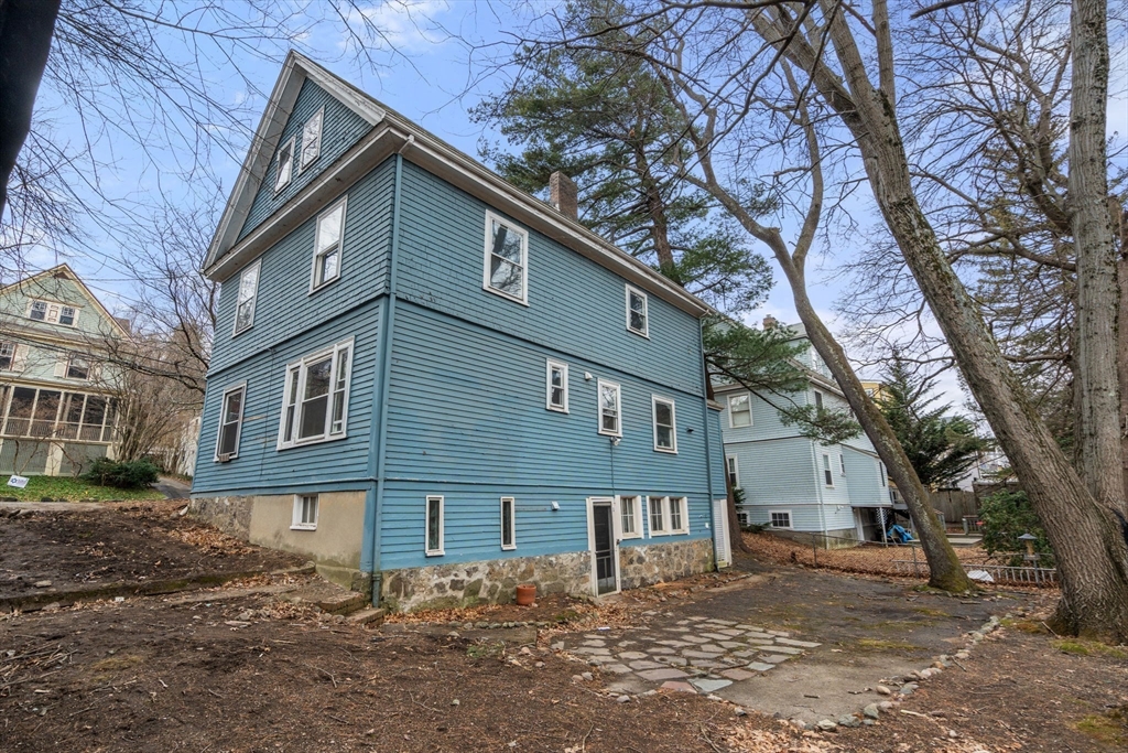 187 Clark Road Brookline, MA 02445 - Photo 37 of 40 a front view of a house with a yard