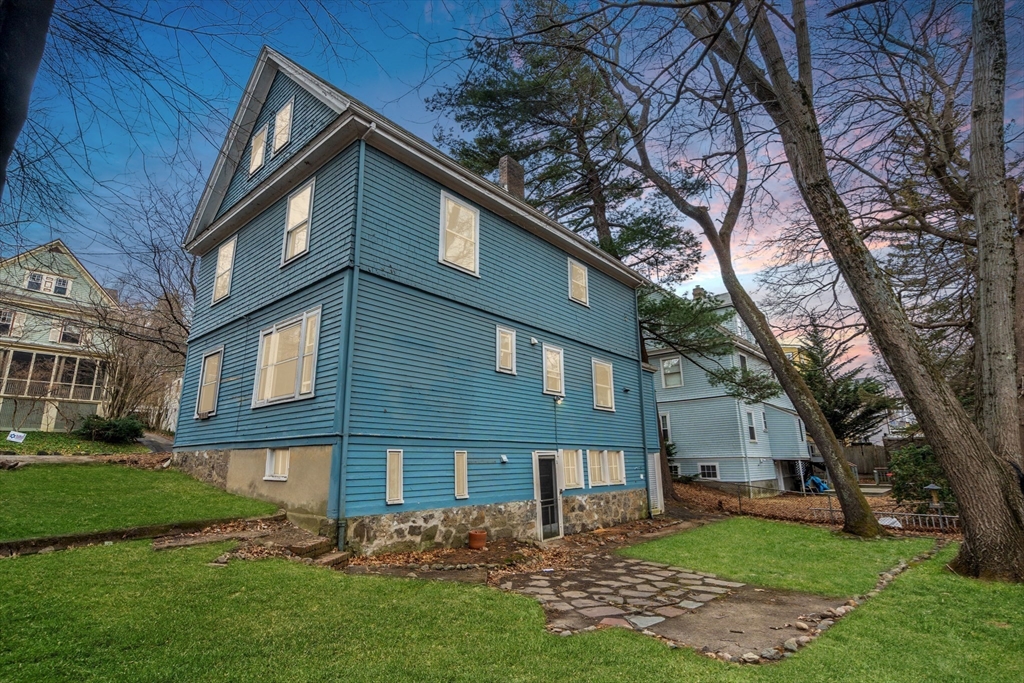 187 Clark Road Brookline, MA 02445 - Photo 5 of 40 a front view of a house with garden