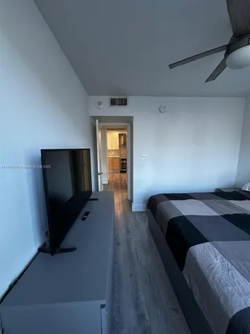 a view of a chairs and tables in a patio