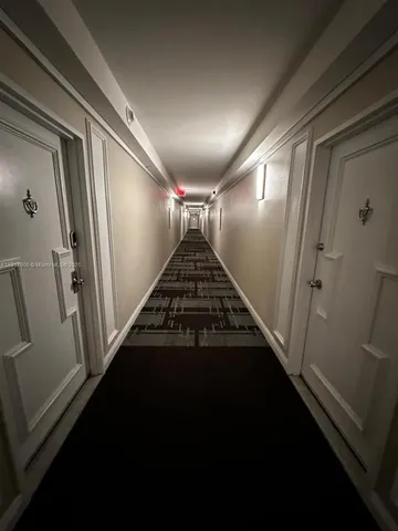 a kitchen with stainless steel appliances kitchen island a refrigerator sink and stove