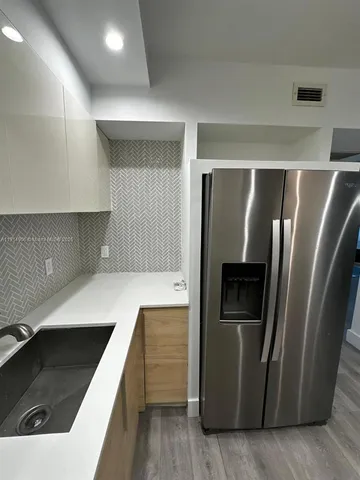 a bathroom with a sink toilet and mirror