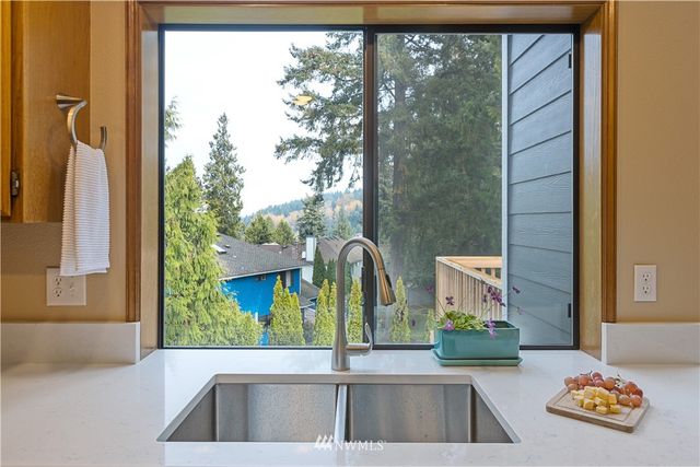 a kitchen with a sink and a window