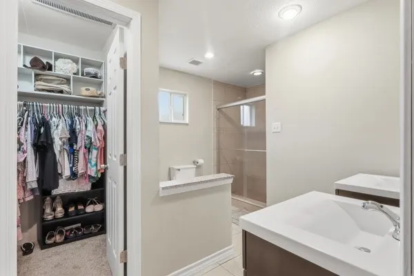 a bathroom with a sink toilet and vanity