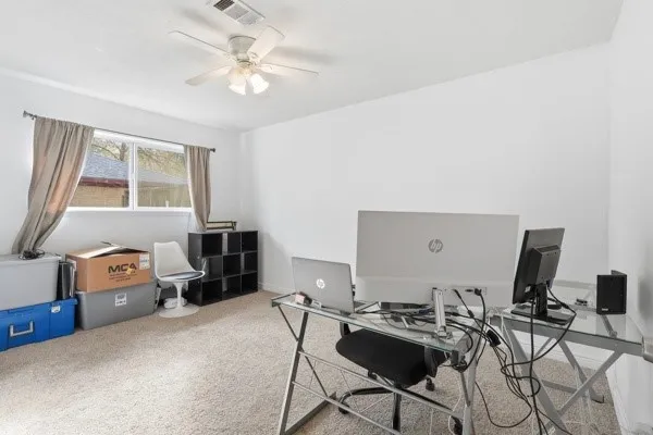 a workspace with furniture and a window