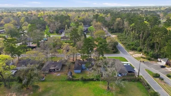 an aerial view of house with yard swimming pool and outdoor seating