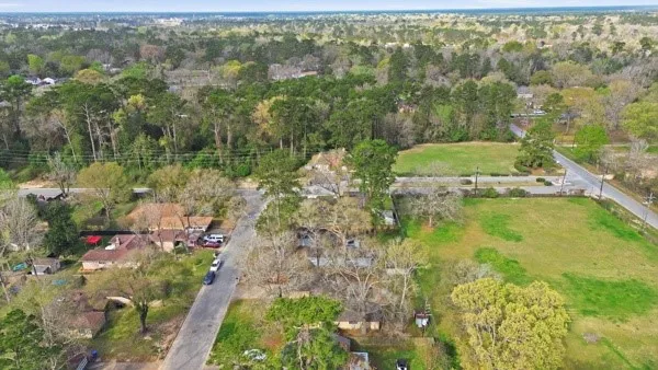 an aerial view of residential houses with outdoor space