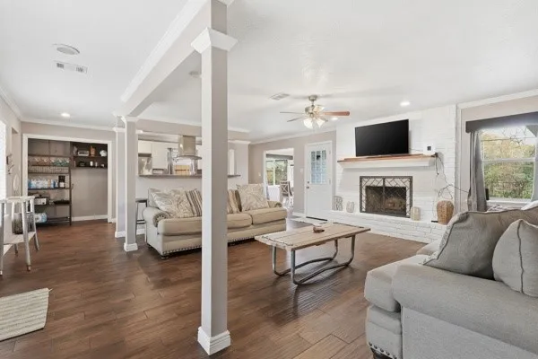 a living room with furniture fireplace and flat screen tv