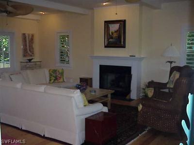 1404 Sand Castle Road Sanibel, FL 33957 - Photo 3 of 10 a living room with furniture and a fireplace