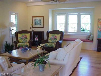 1404 Sand Castle Road Sanibel, FL 33957 - Photo 5 of 10 a living room with furniture fireplace and a large window