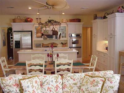 1404 Sand Castle Road Sanibel, FL 33957 - Photo 6 of 10 a bedroom with furniture and a large mirror