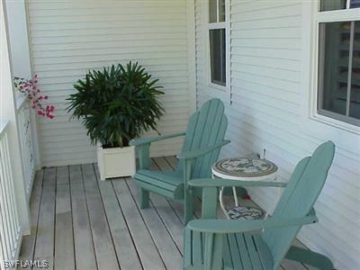 1404 Sand Castle Road Sanibel, FL 33957 - Photo 10 of 10 a balcony with table and chairs