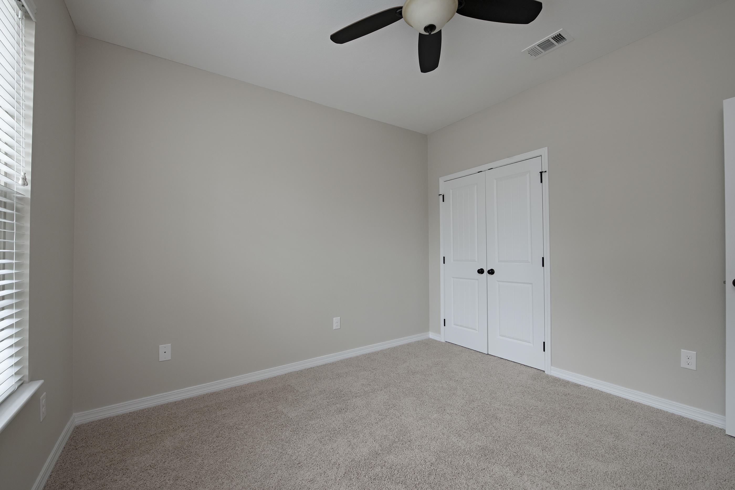 6210 Timberland Ridge Drive Crestview, FL 32539 - Photo 31 of 37 an empty room with a window and a ceiling fan