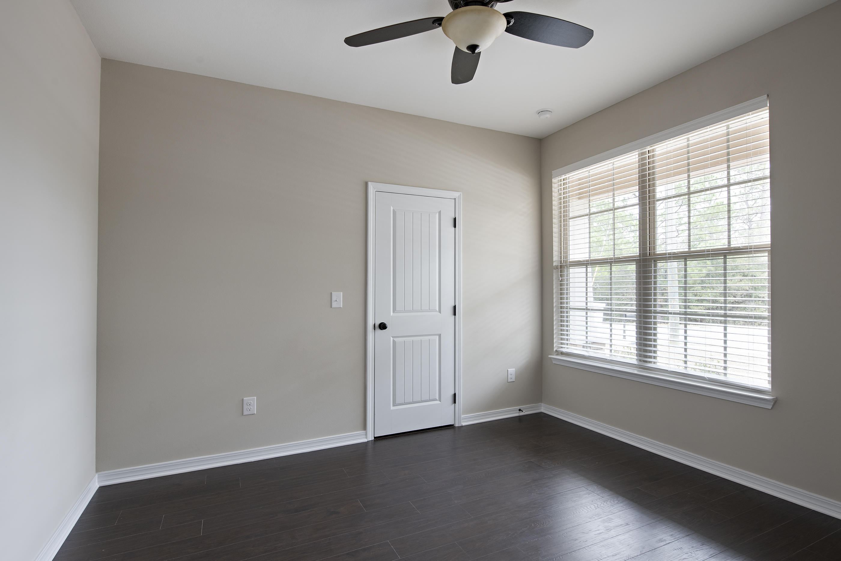 6210 Timberland Ridge Drive Crestview, FL 32539 - Photo 6 of 37 a view of an empty room with a window and wooden floor