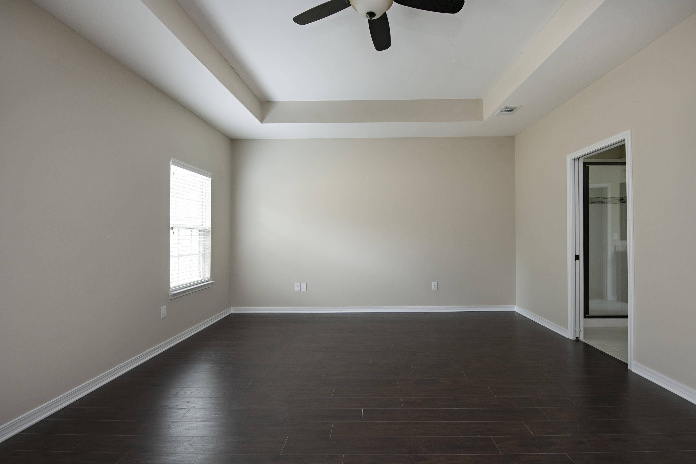 6210 Timberland Ridge Drive Crestview, FL 32539 - Photo 9 of 37 an empty room with wooden floor and windows