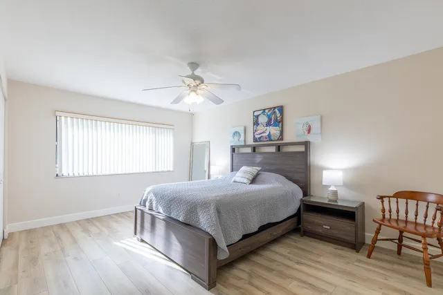 a bedroom with a bed and a table