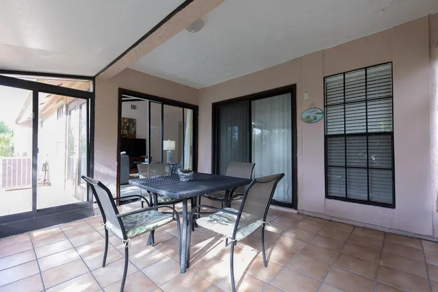 a view of a dining room with furniture and window
