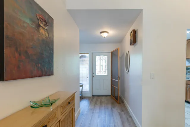 a view of entryway with wooden floor