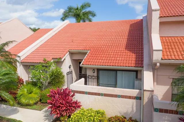 a front view of a house with a garage
