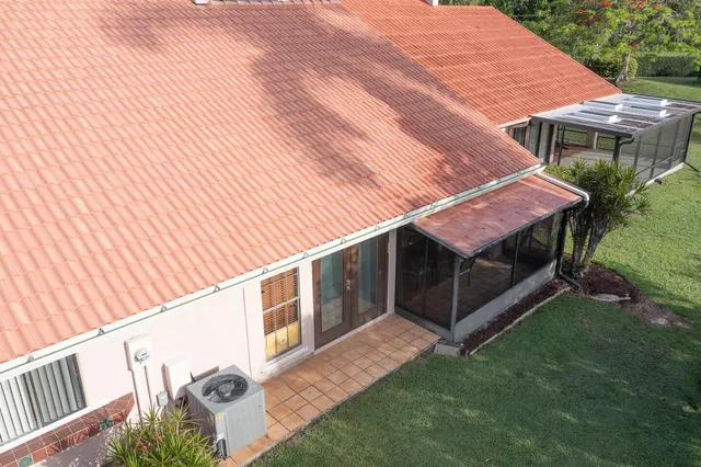 a view of backyard with deck and outdoor seating