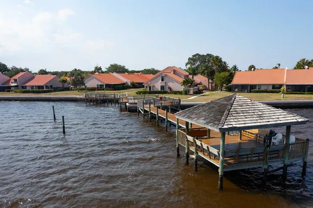 an aerial view of a house with balcony and outdoor space