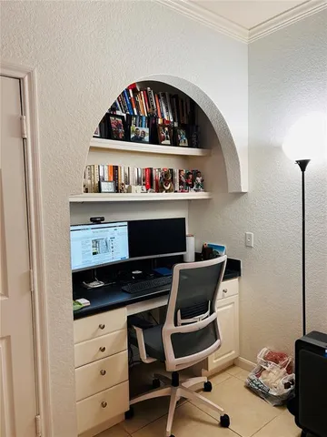 a kitchen with a stove a refrigerator and cabinets
