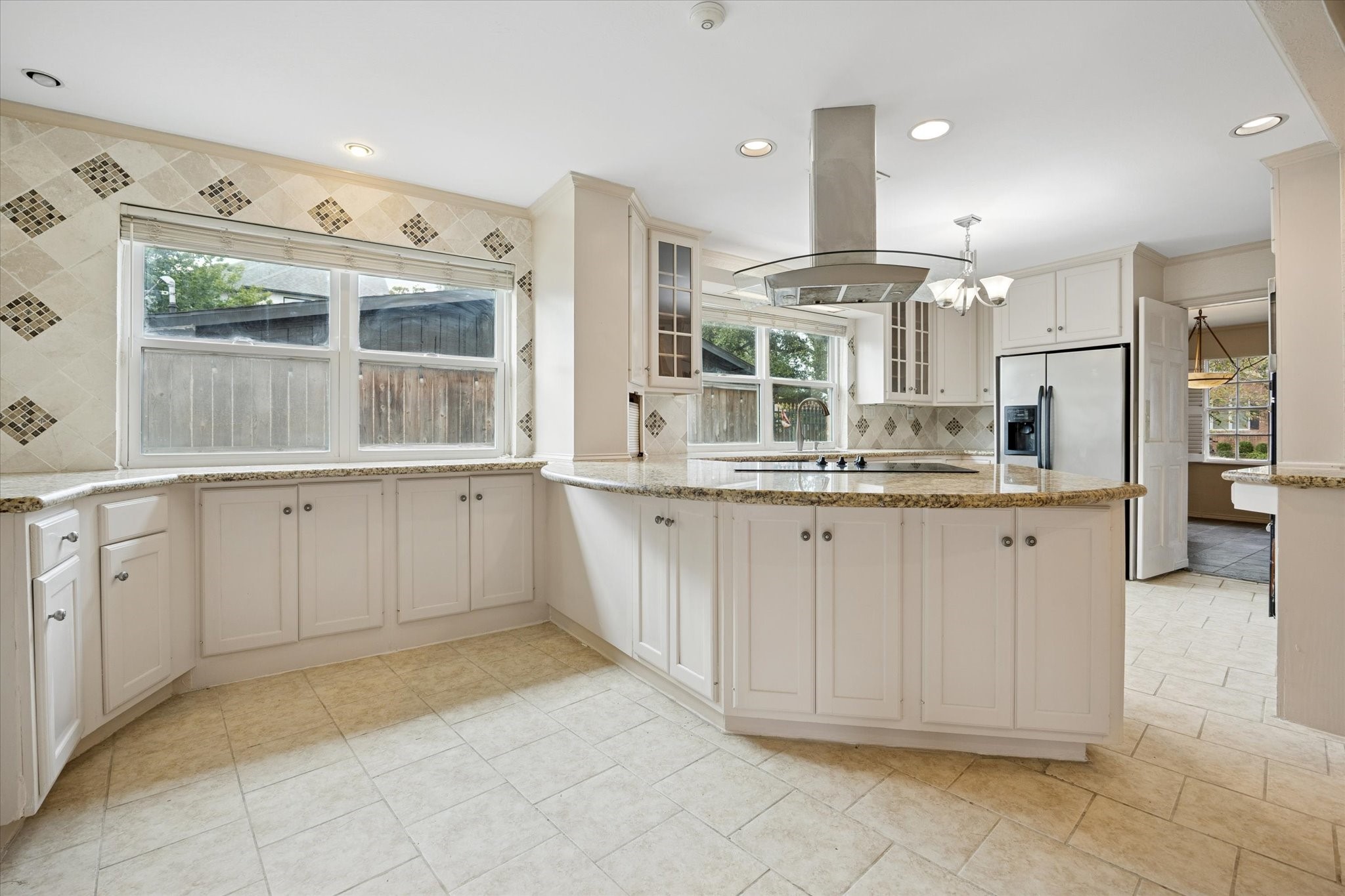 4919 Valkeith Drive Houston, TX 77096 - Photo 11 of 29 a large white kitchen with a large window
