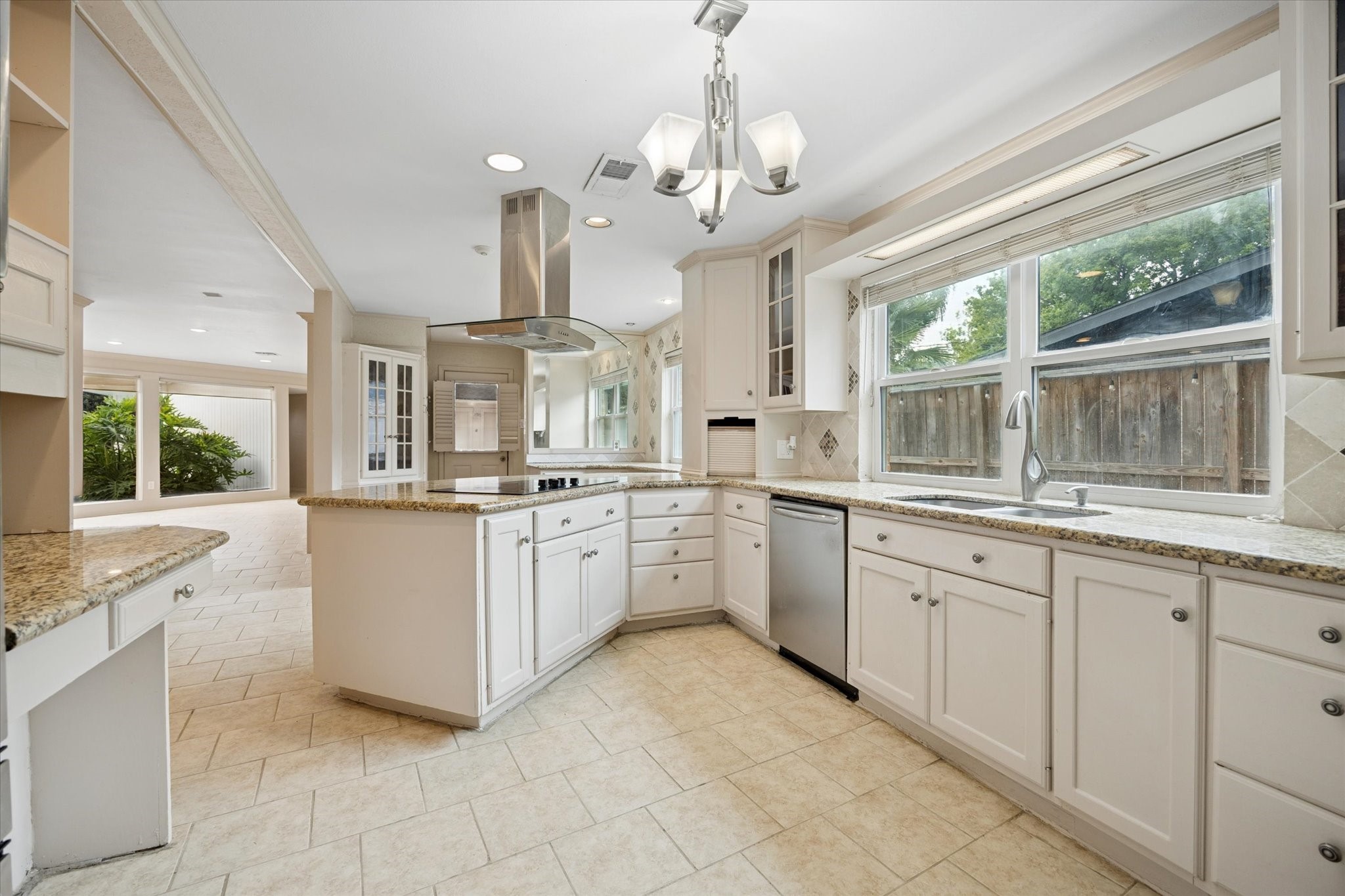4919 Valkeith Drive Houston, TX 77096 - Photo 13 of 29 a large white kitchen with a large window