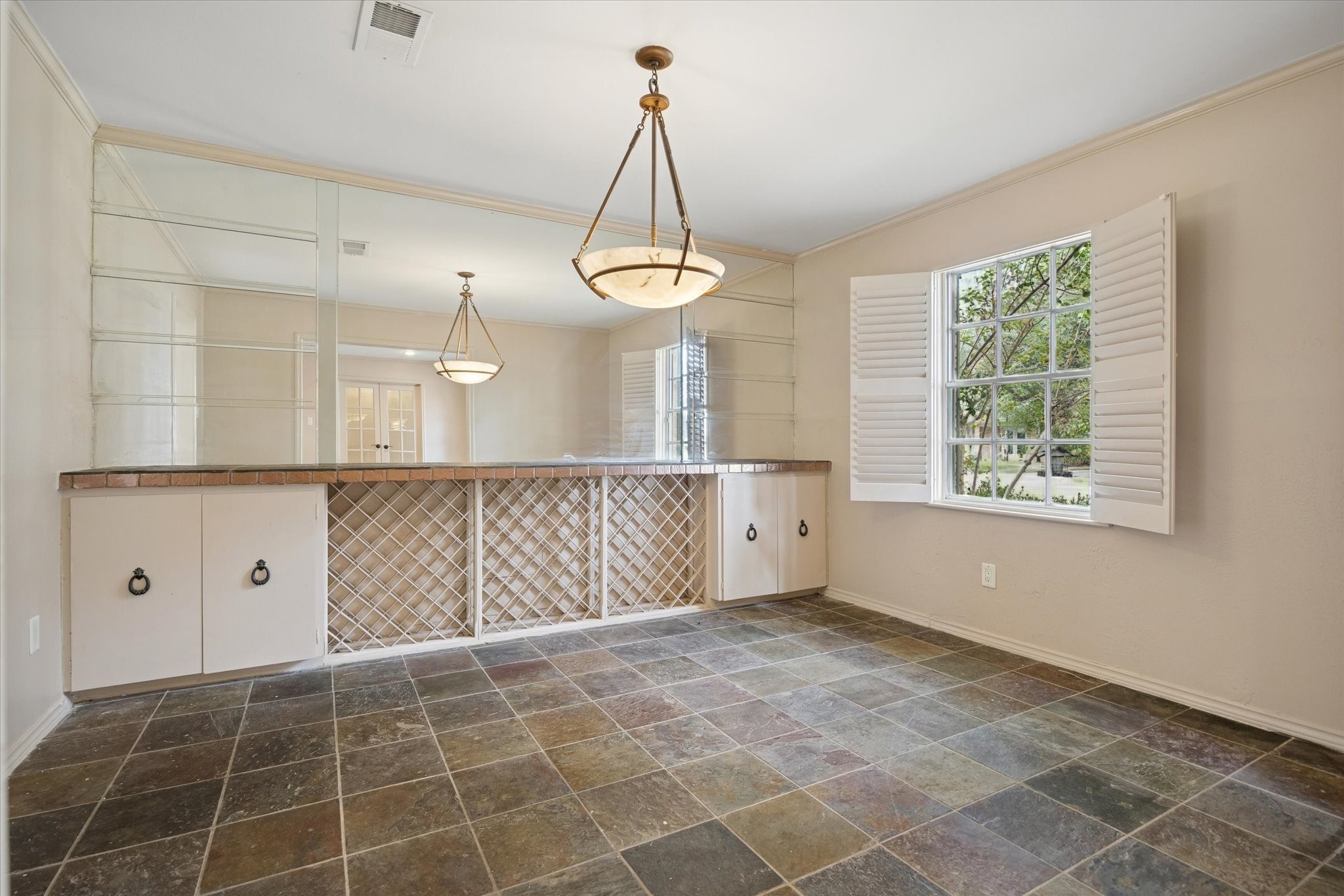 4919 Valkeith Drive Houston, TX 77096 - Photo 18 of 29 a view of an empty room with window and chandelier fan