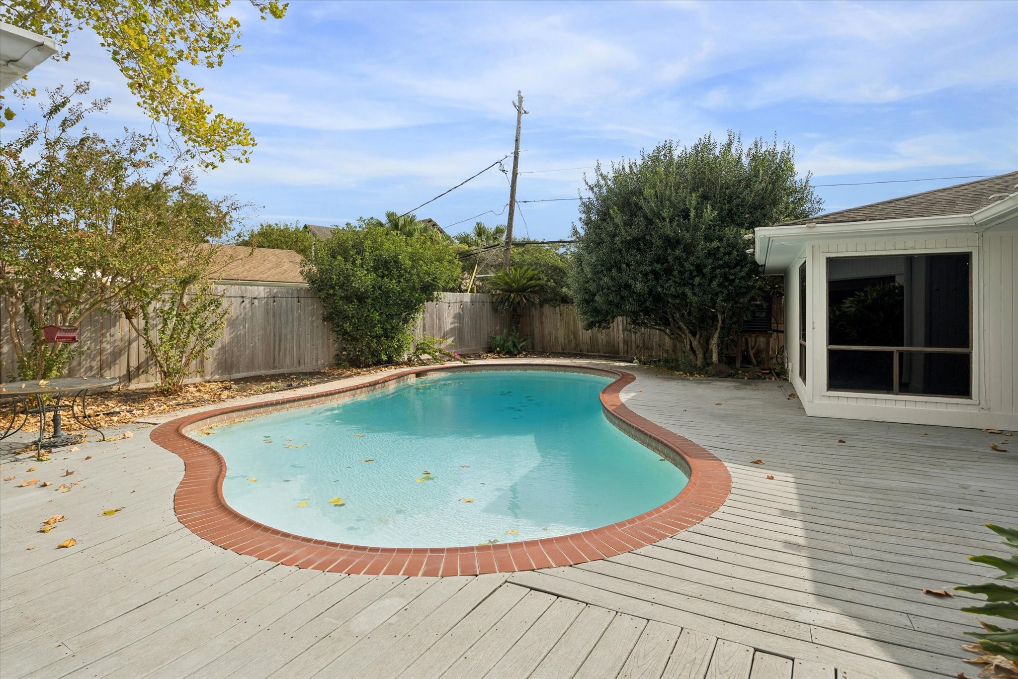 4919 Valkeith Drive Houston, TX 77096 - Photo 27 of 29 a view of a swimming pool with a yard