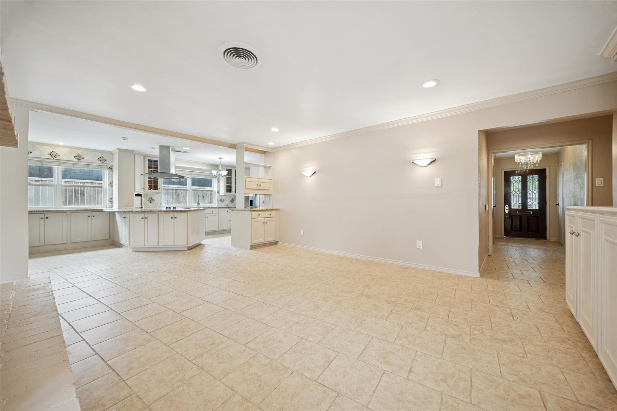 4919 Valkeith Drive Houston, TX 77096 - Photo 5 of 29 a view of empty room with kitchen and window
