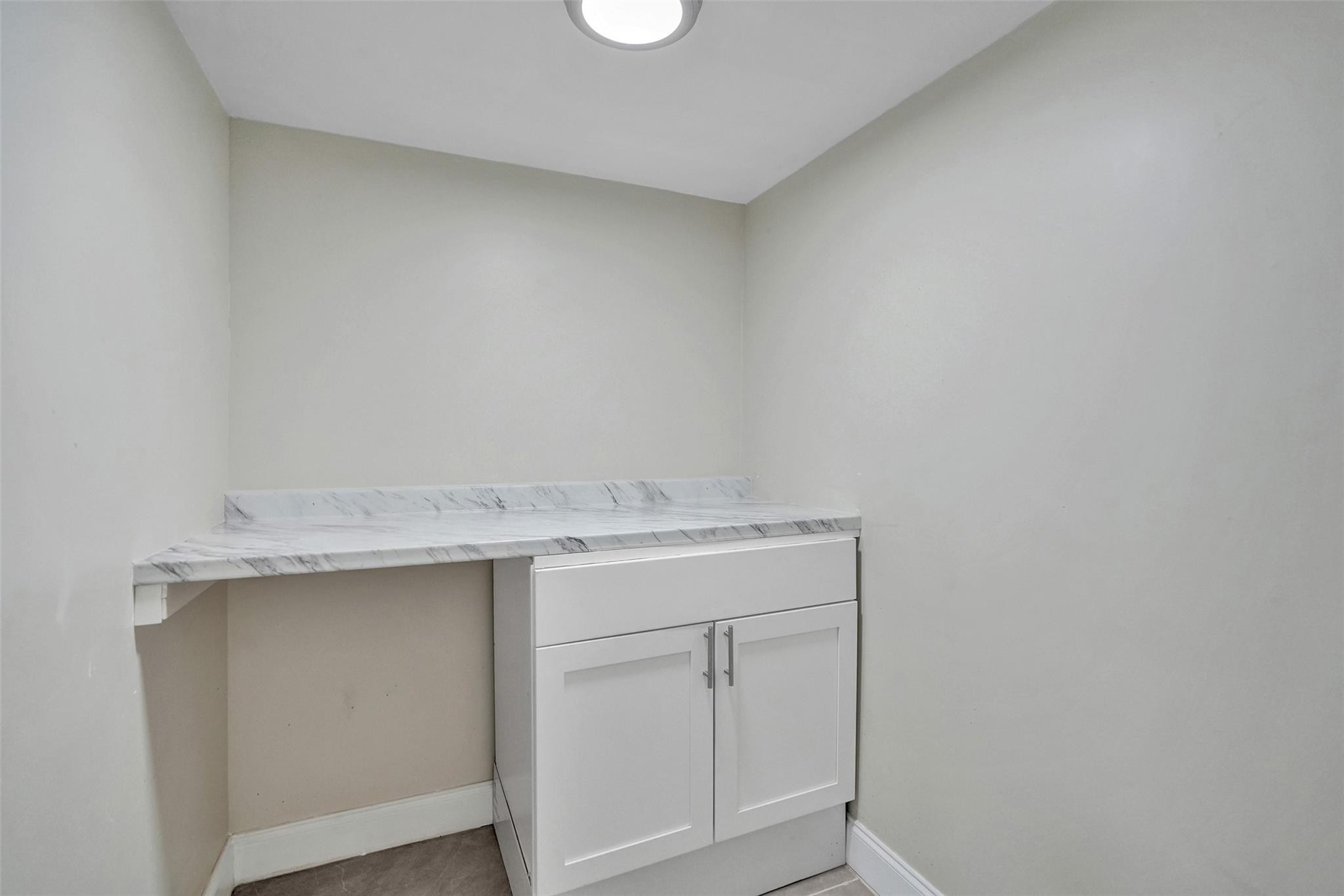 4222 Inverrary Boulevard, Unit 4810 Lauderhill, FL 33319 - Photo 55 of 63 a utility room with a sink