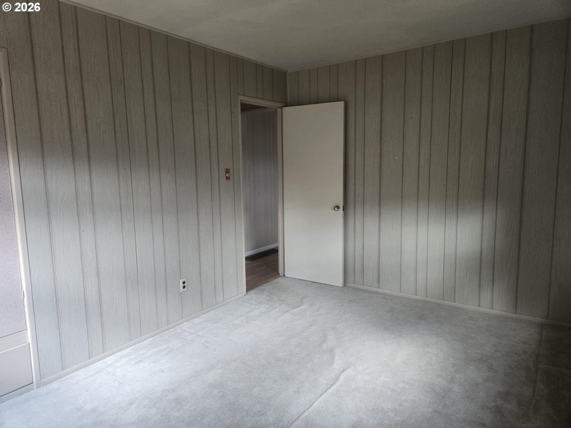 3405 Southeast 69th Avenue Portland, OR 97206 - Photo 14 of 23 a view of an empty room with wooden walls