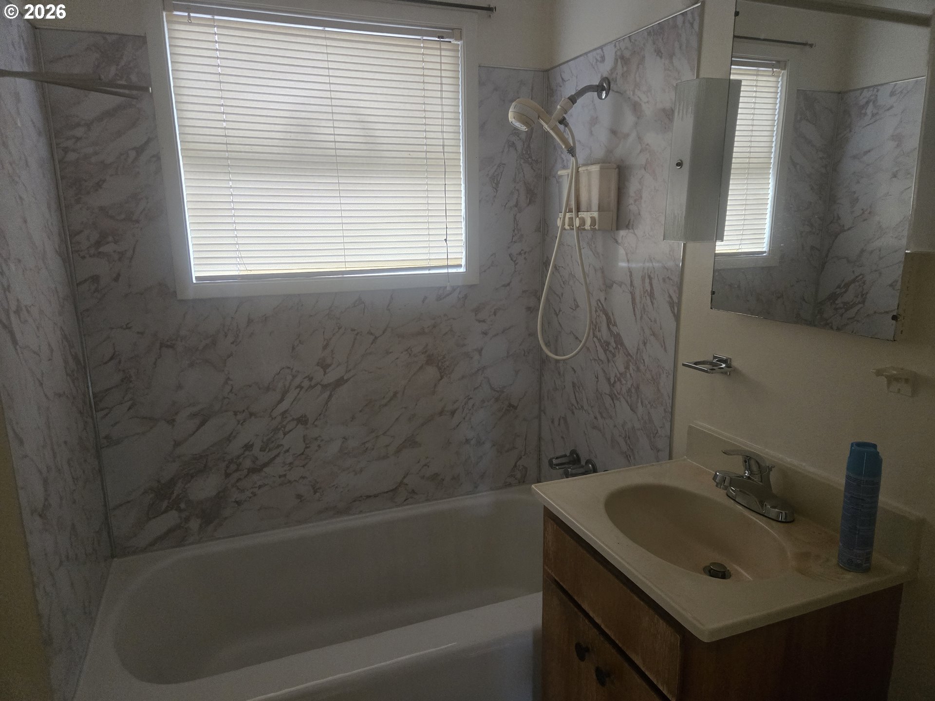 3405 Southeast 69th Avenue Portland, OR 97206 - Photo 15 of 23 a bathroom with a sink and a bathtub
