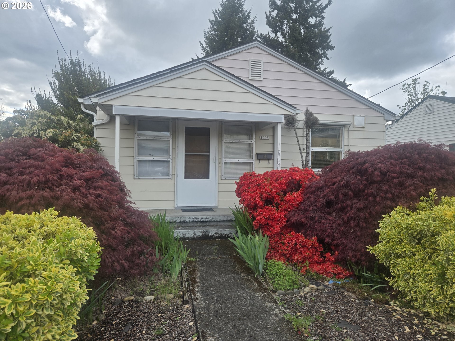 3405 Southeast 69th Avenue Portland, OR 97206 - Photo 3 of 23 a front view of house with a yard