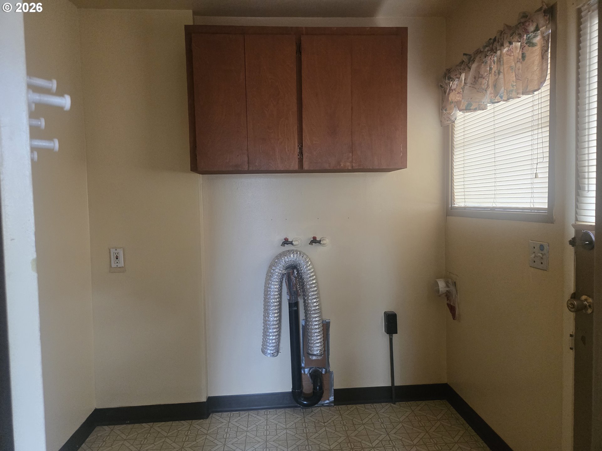 3405 Southeast 69th Avenue Portland, OR 97206 - Photo 9 of 23 a view of a utility room with cabinets