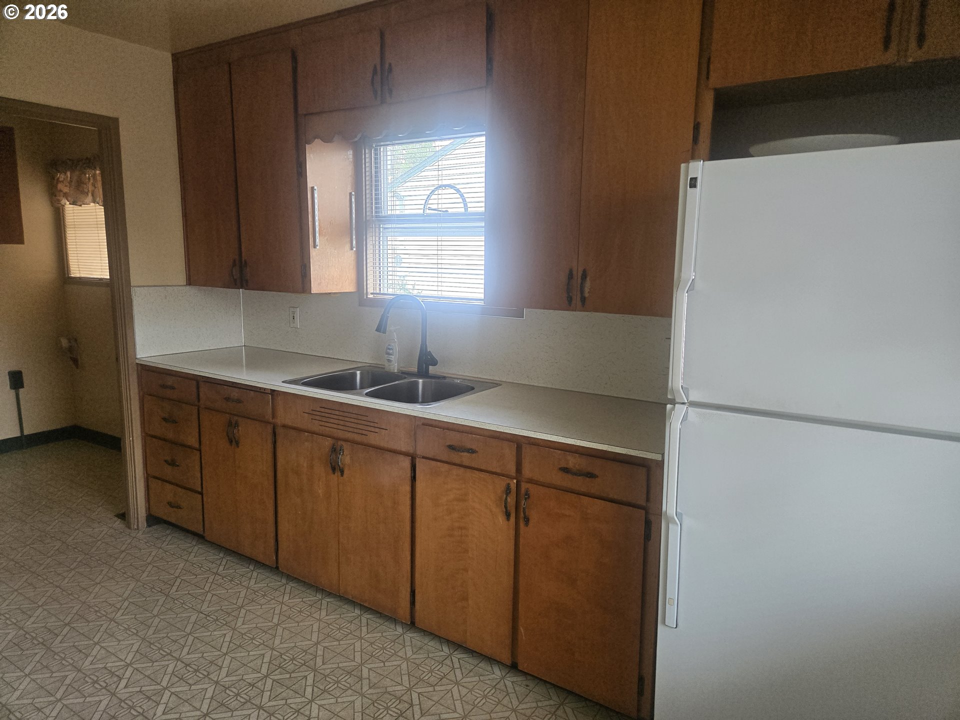 3405 Southeast 69th Avenue Portland, OR 97206 - Photo 10 of 23 a kitchen with a sink and cabinets