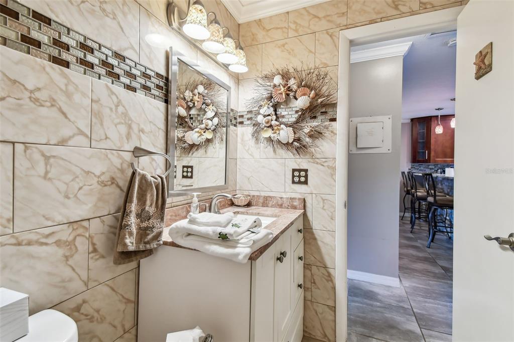 7200 Ulmerton Road, Unit E3 Largo, FL 33771 - Photo 16 of 26 a bathroom with a sink and mirror