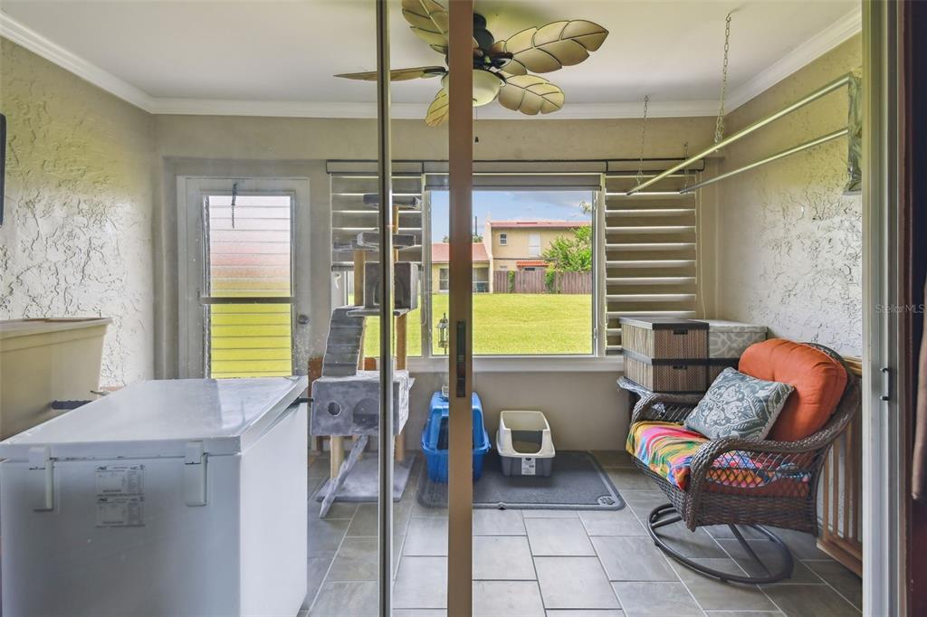 7200 Ulmerton Road, Unit E3 Largo, FL 33771 - Photo 17 of 26 a living room with furniture and a window
