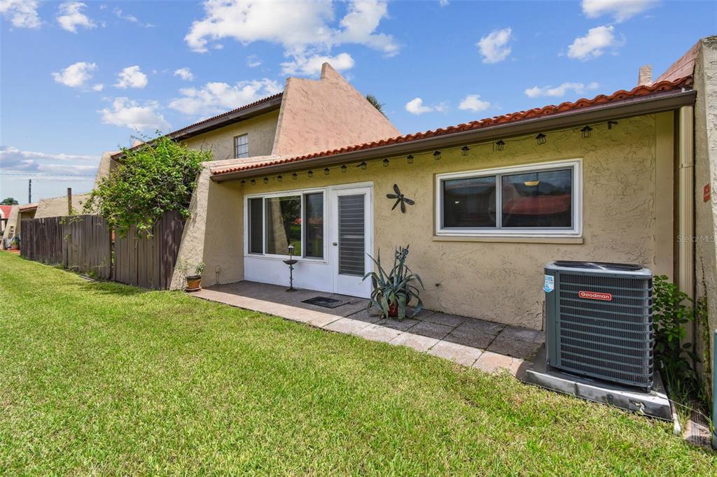 7200 Ulmerton Road, Unit E3 Largo, FL 33771 - Photo 19 of 26 a front view of a house with a yard
