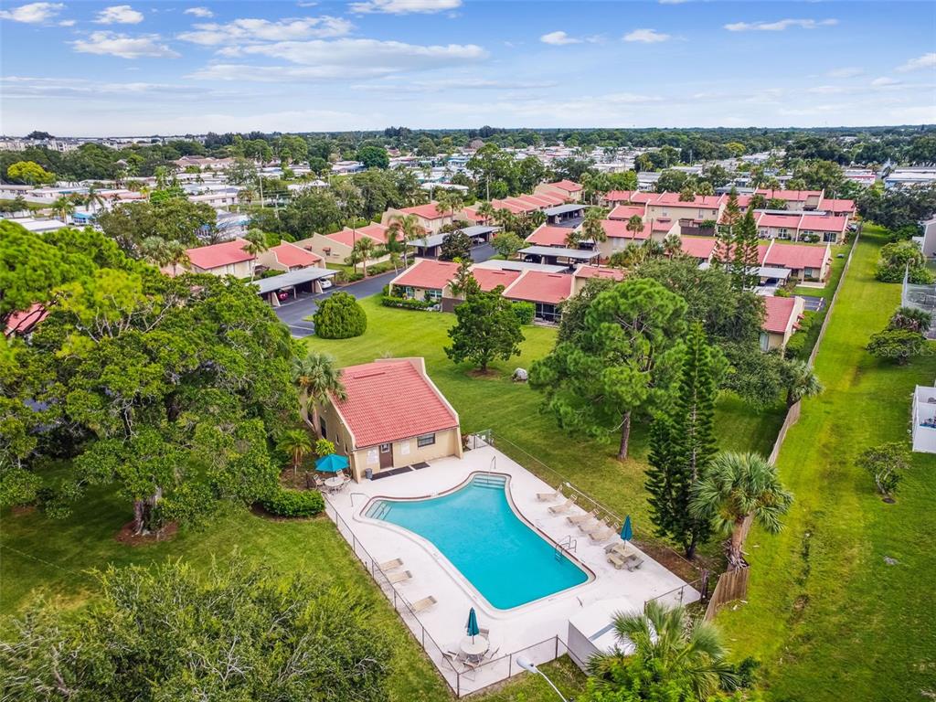 7200 Ulmerton Road, Unit E3 Largo, FL 33771 - Photo 24 of 26 an aerial view of residential houses with outdoor space and trees