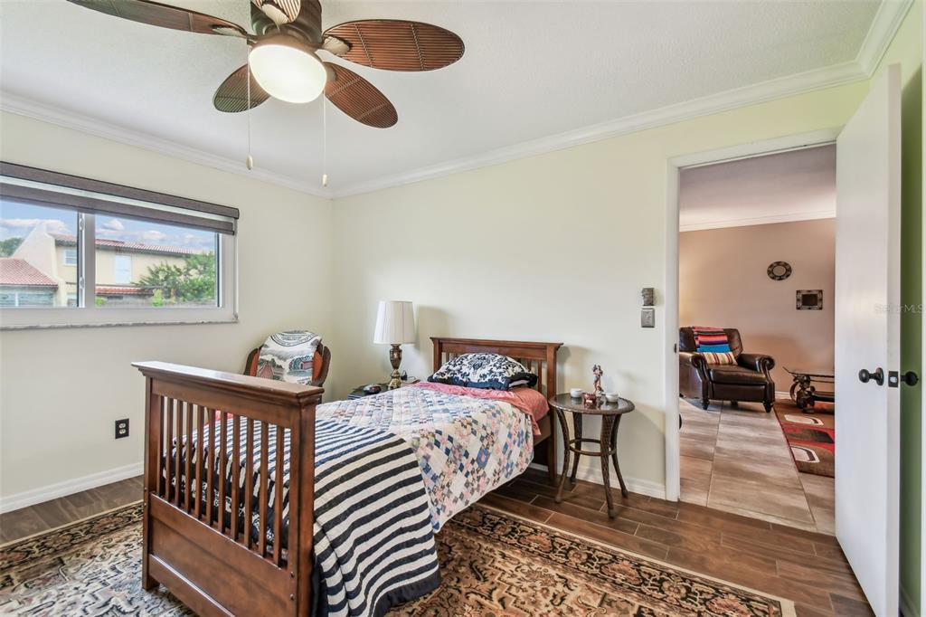7200 Ulmerton Road, Unit E3 Largo, FL 33771 - Photo 9 of 26 a bedroom with bed and a window